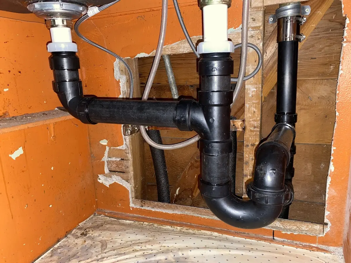 Professional Garbage Disposal Repair equipment and tools on the job in Harrison